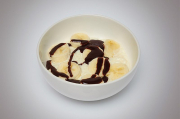 Rice pudding with chocolate sauce and banana